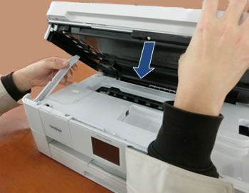 Hold tip of scanner cover support, and lower scanner cover