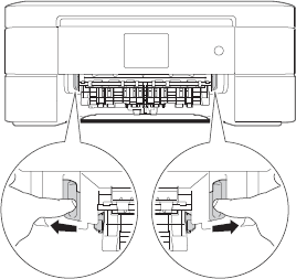 Pull two green levers inside machine to release jammed paper