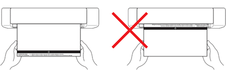 Hold the edges of the calibration sheet and insert it