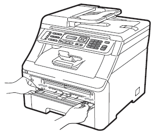 Slide the manual feed slot paper guides