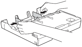 Press paper side guide to fit paper size