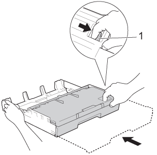 Shorten the tray by pressing the universal guide release button