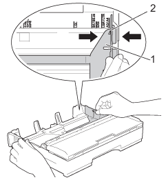 Slide the paper guides