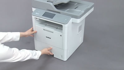 Push the paper tray completely into the machine
