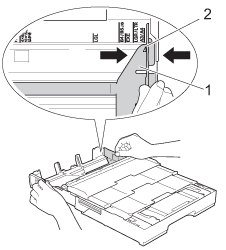 Slide the paper guides