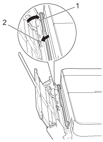 Lift the cover forward and push the release lever