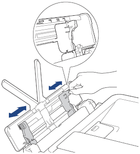 Deslice las guías del papel de la bandeja multipropósito.