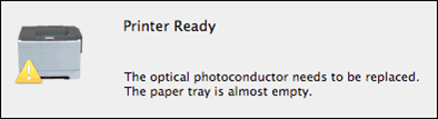 en melding: Den optiske fotolederen må byttes ut./ Papirmagasinet er nesten tomt.