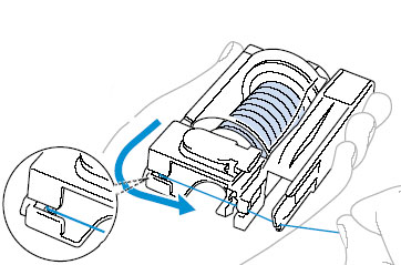 Pass the thread along the bottom of the thread cassette.